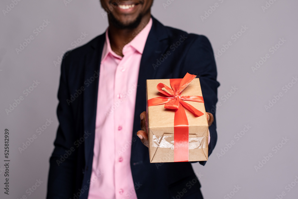 black man holding a gift black man holding a gift