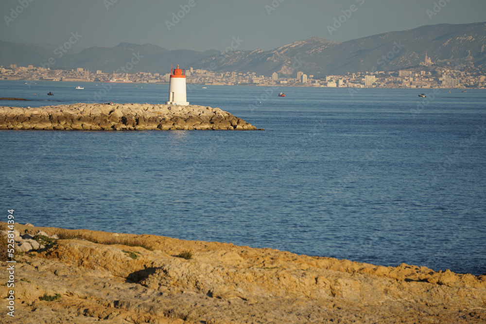 red and white lighthouse on the mediterranean coast in the calanques across marseille france