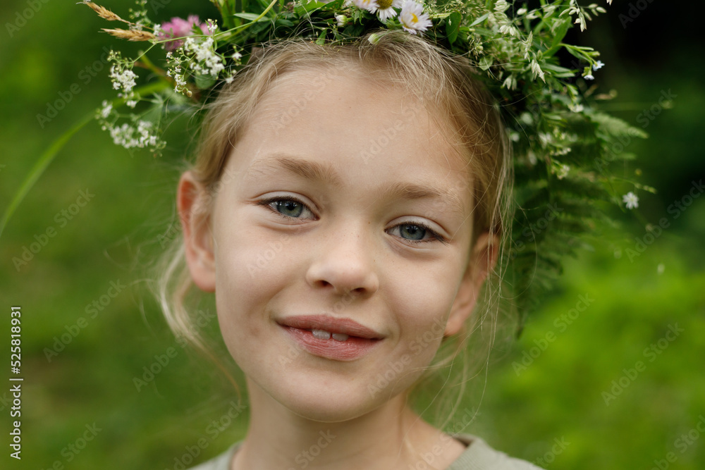 Slavic ritual on the equinox, portrait of a pagan child girl with a wreath on her head. Slavic ritual on the equinox, portrait of a pagan child girl with a wreath on her head.