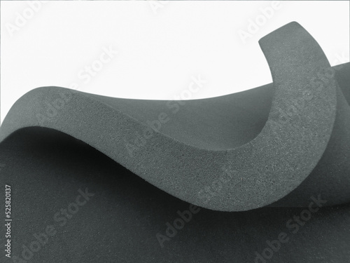 thick black sponge foam texture. curved sheet isolated on a white background