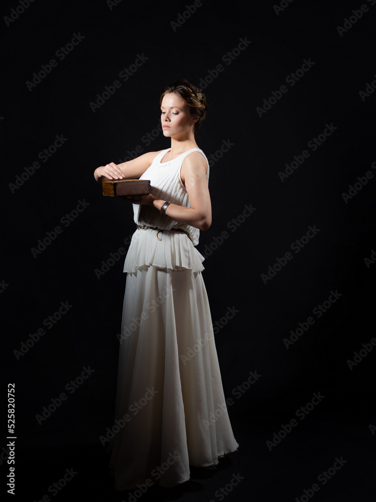 An ancient heroine holds a pandora's box in her hands, a young woman in the image of an ancient Greek goddess or muse. A noble heroine in a white tunic and a laurel wreath, An ancient heroine holds a pandora's box in her hands, a young woman in the image of an ancient Greek goddess or muse. A noble heroine in a white tunic and a laurel wreath,