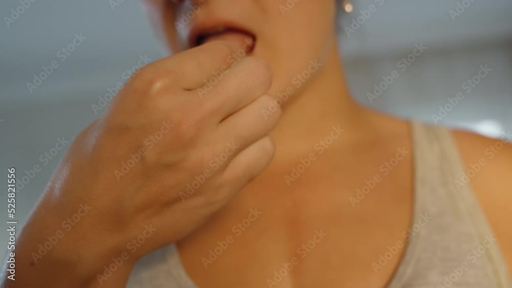 The girl tries dogwood and winces from the acid. close-up. in motion. slow motion