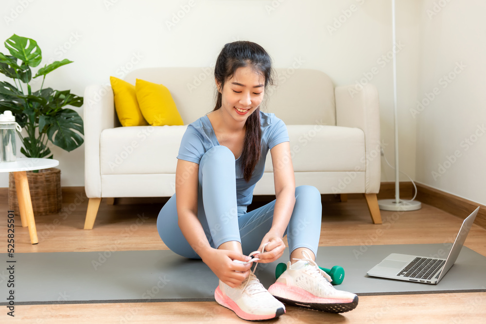 Healthy lifestyle young woman fitness gym for body slim. Young people girl exercise at living room on line. Fitness instructor exercising the fitness. Diet and Healthy sport Concept Healthy lifestyle young woman fitness gym for body slim. Young people girl exercise at living room on line. Fitness instructor exercising the fitness. Diet and Healthy sport Concept