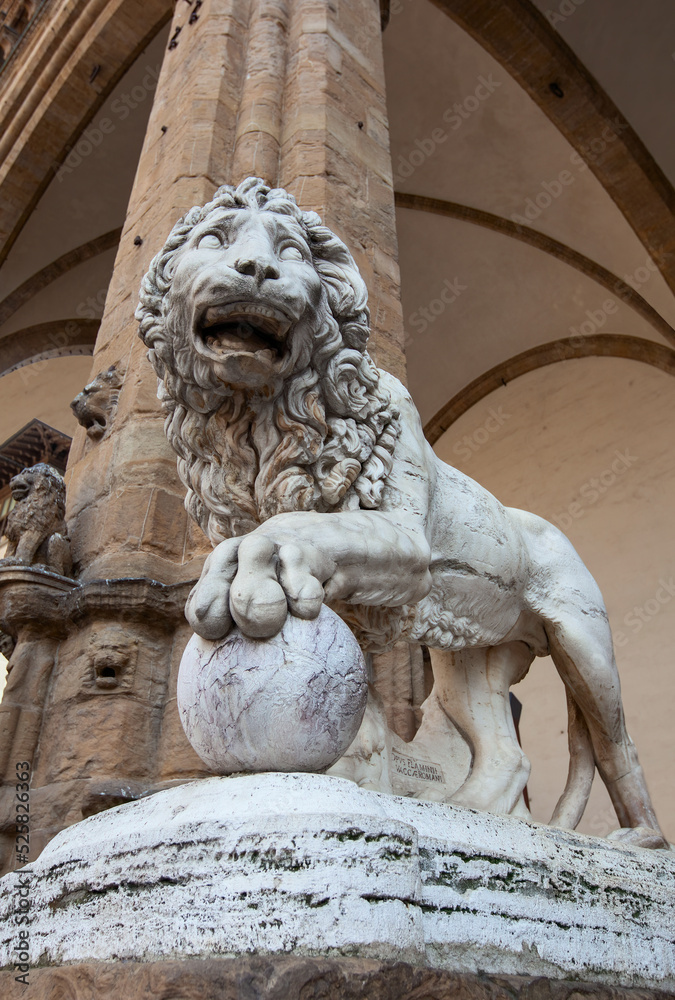 Lion statue covered with the birds droppings in Florence, Italy. 