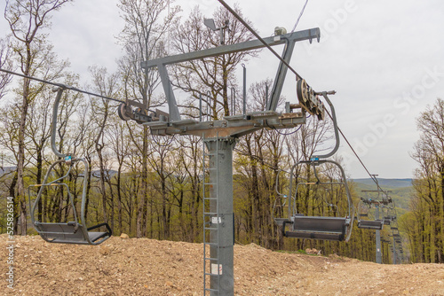 The city of Goryachy Klyuch, chairlifts in the forest. A cable car for climbing to the top of the mountain without people.