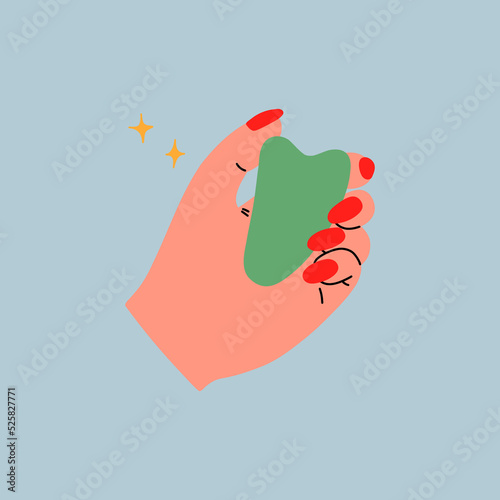 Gua Sha facial massage tools. Green jade roller, scraper and face oil.