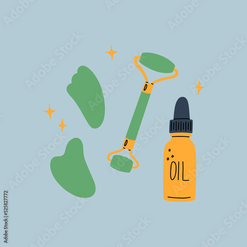 
Gua Sha facial massage tools. Green jade roller, scraper and face oil.
