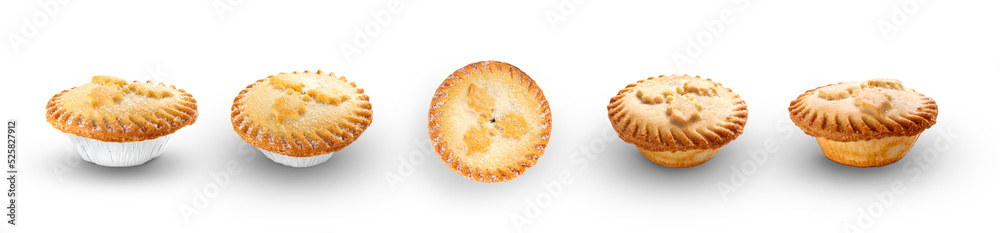 A collection of Christmas mince pies isolated against a flat background.