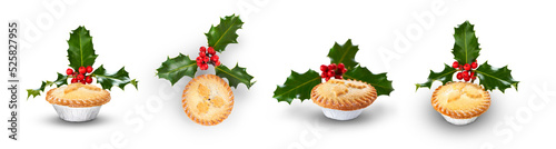 Obraz na płótnie A collection of Christmas mince pies with holly isolated against a flat background. w salonie