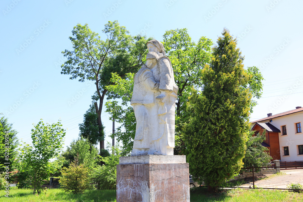 White monument with two women in Kosovo, Ukraine