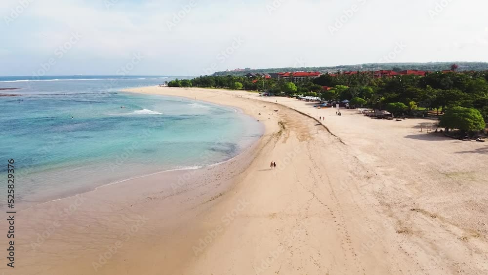 Aerial - drone shot of stunning beach with white sand and turquoise water in tropical paradise Aerial - drone shot of stunning beach with white sand and turquoise water in tropical paradise