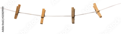Old wooden clothespins on a rope isolated on  transparent background