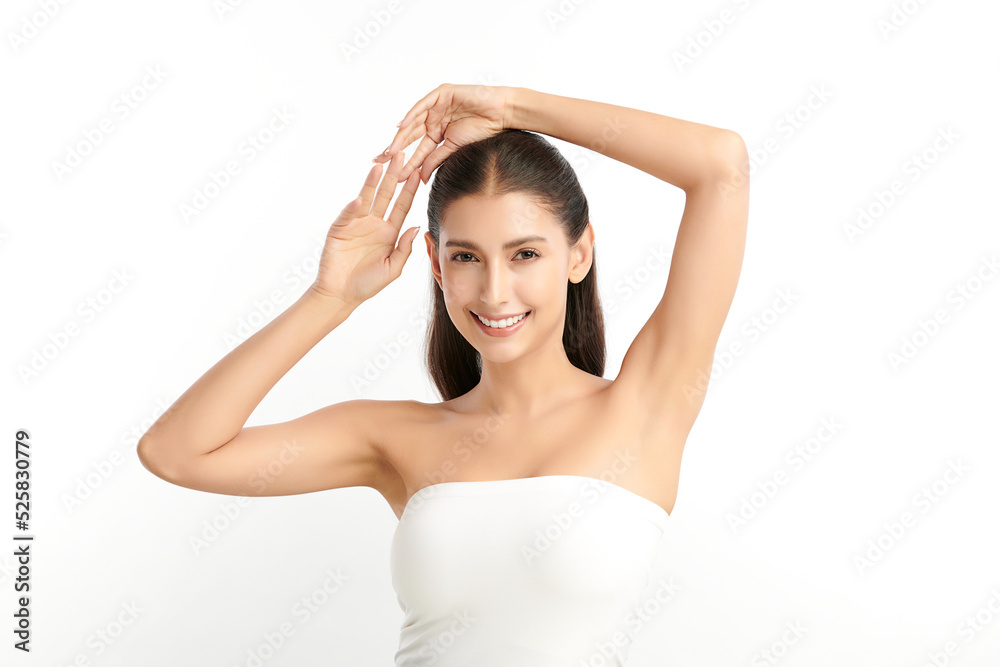 Beautiful Young Asian woman lifting hands up to show off clean and hygienic armpits or underarms on white background, Smooth armpit cleanliness and protection concept