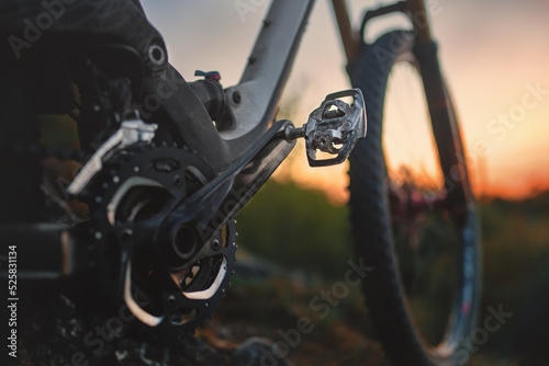 Selective focus on the mountain bike pedal in the field. 