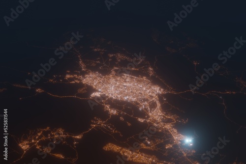 Aerial shot of Shiraz (Iran) at night, view from north. Imitation of satellite view on modern city with street lights and glow effect. 3d render