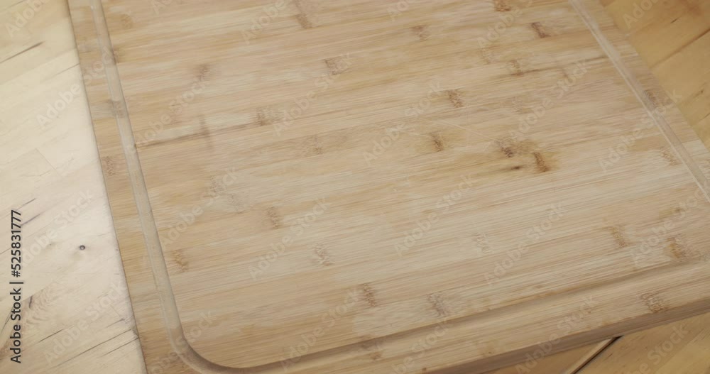Home chef cooking - high angle view, placing cutting board and mixing bowl. Home chef cooking - high angle view, placing cutting board and mixing bowl.