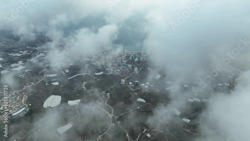 Over the city in the clouds aerila view 4 K Turkey Alanya  photo