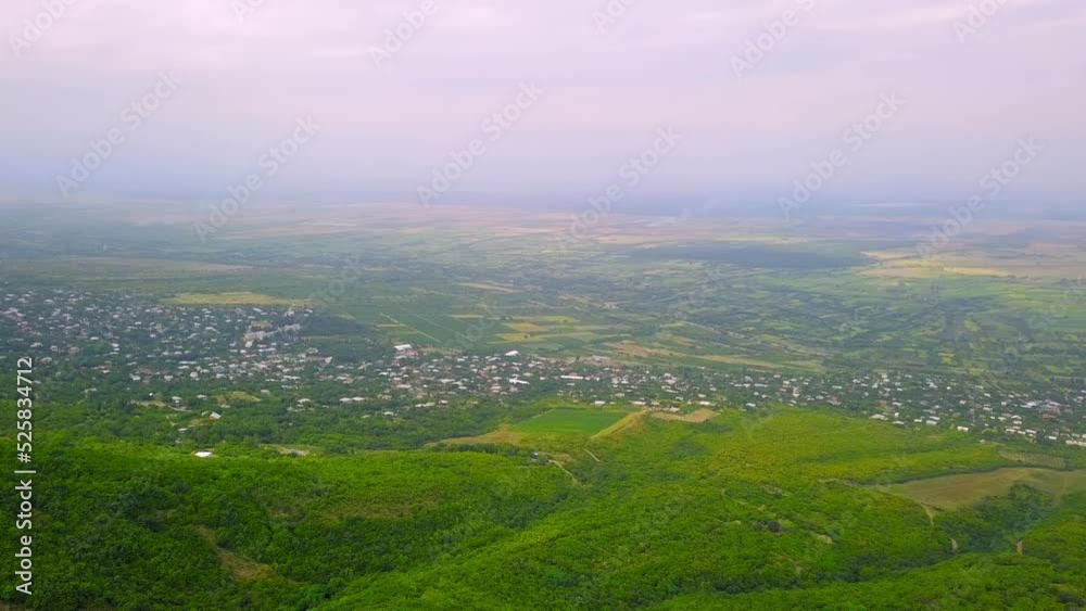 Aerial view of houses in town of Sighnaghi, eastern Georgia Scenic spring view from drone village of Sighnaghi with narrow winding streets located on hill in foothills of Gombori Range, Georgia Aerial view of houses in town of Sighnaghi, eastern Georgia Scenic spring view from drone village of Sighnaghi with narrow winding streets located on hill in foothills of Gombori Range, Georgia