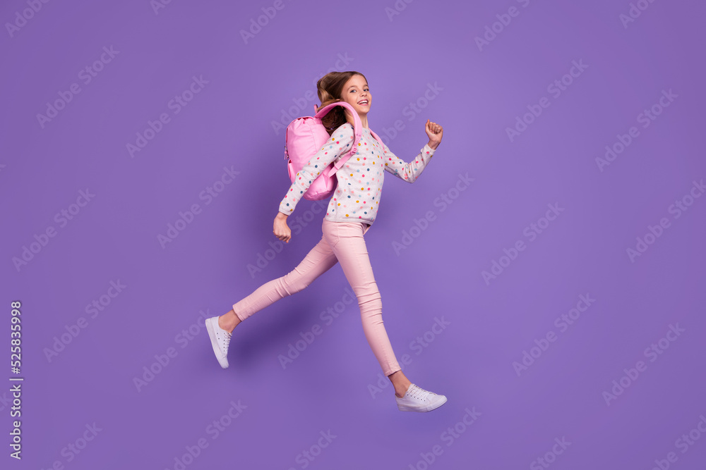 Full size profile photo of excited sporty girl jump hurry rush lesson isolated on violet color background