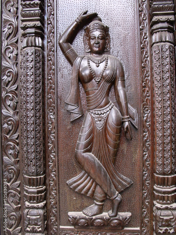 Kathmandu, Nepal, August 20, 2011: Carved wooden door in a square in Kathmandu. Nepal