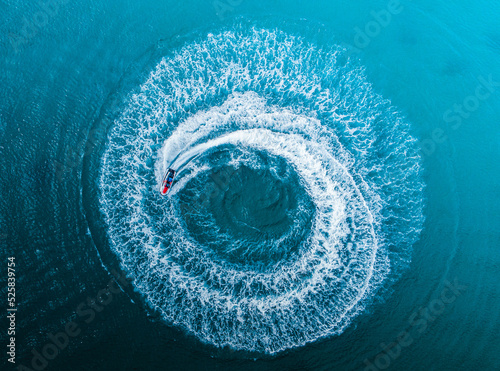 Ocean shot with a circle of water motion drone wallpaper created by a jetski from puerto rico luquillo la monseratte beach. © emaotx