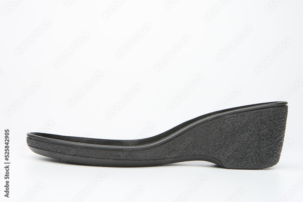 Rubber outsole for shoes. Sole of womans shoes close-up. Concept of production of footwear and wardrobe items from polypropylene. Rubber outsole side view. Basis for womans shoes. Rubber outsole for shoes. Sole of womans shoes close-up. Concept of production of footwear and wardrobe items from polypropylene. Rubber outsole side view. Basis for womans shoes.