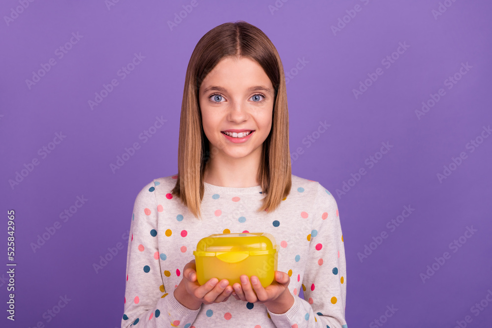 Photo of adorable cute pupil hands hold lunch box container isolated on violet color background