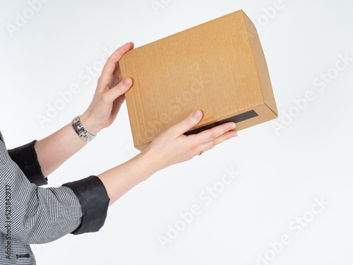 Cardboard box in womans han...