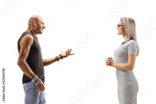 Profile shot of a male hipster talking to a young blond woman