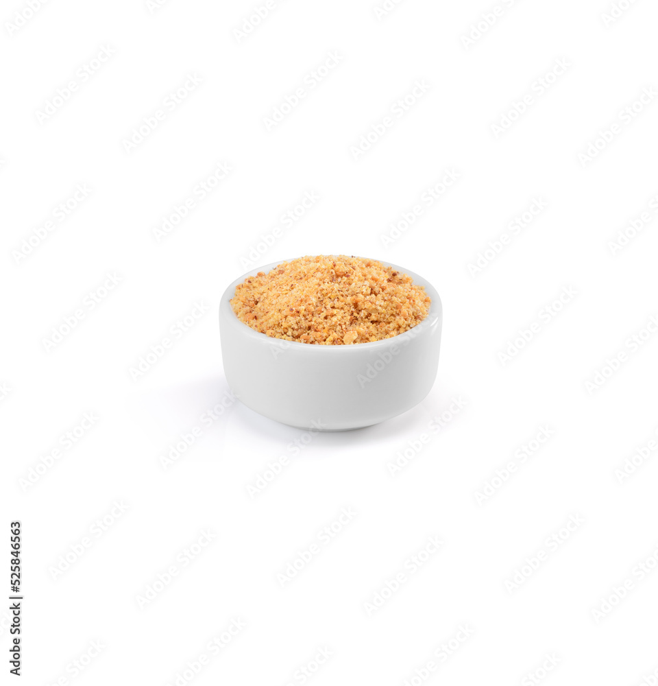 Rostead grated peanuts on a white ceramic ramekin, isolated on white Rostead grated peanuts on a white ceramic ramekin, isolated on white