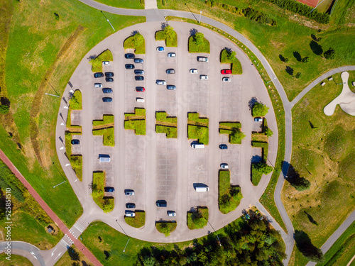 Drone Point of View on Round Parking Lot near a Public Park