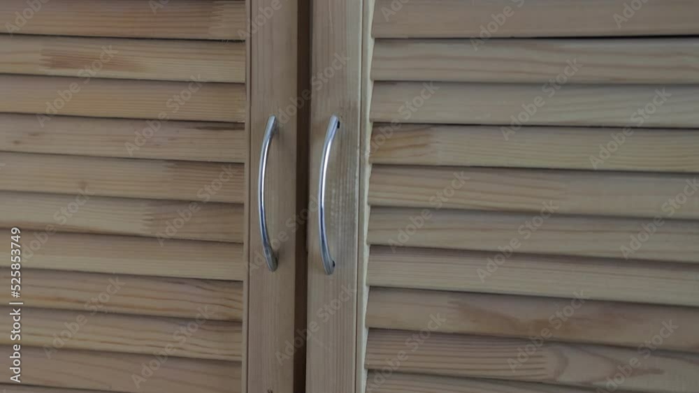 the doors of the blinds of a homemade wooden cabinet the doors of the blinds of a homemade wooden cabinet