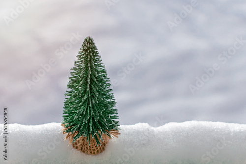 toy Christmas tree in the snow