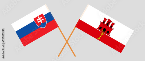 Crossed flags of Slovakia and Gibraltar. Official colors. Correct proportion