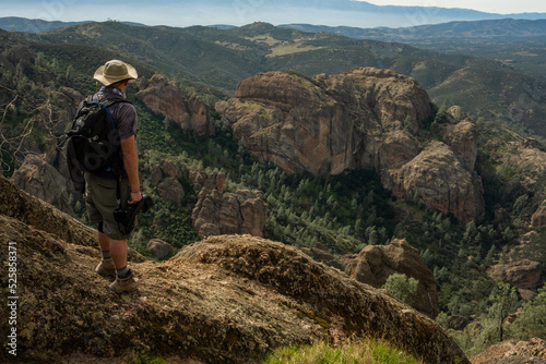 Hiker Looks Out Over The Western Side of Pinnacles From The High Peaks Trail photo