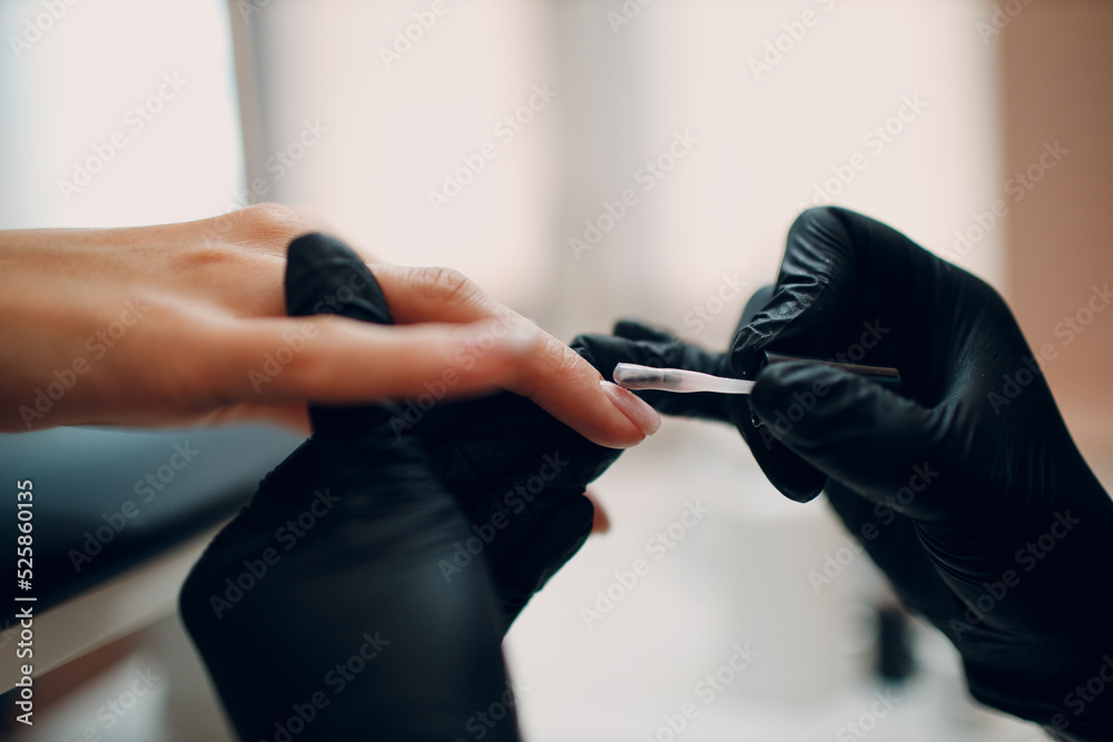 Manicure process female hands finger nails lacquer applying nail polish. Manicure process female hands finger nails lacquer applying nail polish.
