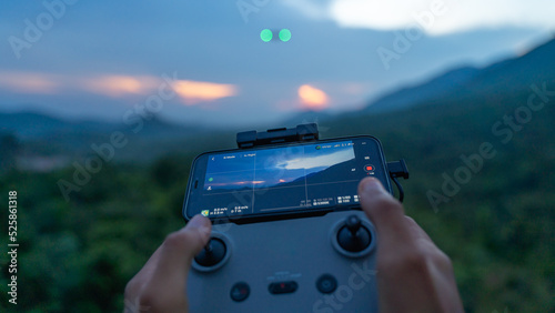 Photography Remote control operating the Drone, man controlling an unmanned aerial vehicle