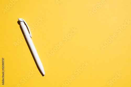 white pen on a yellow background, free space. Place for text