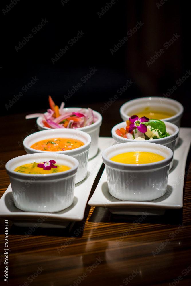 Little white bowls with traditional peruvian sauces food