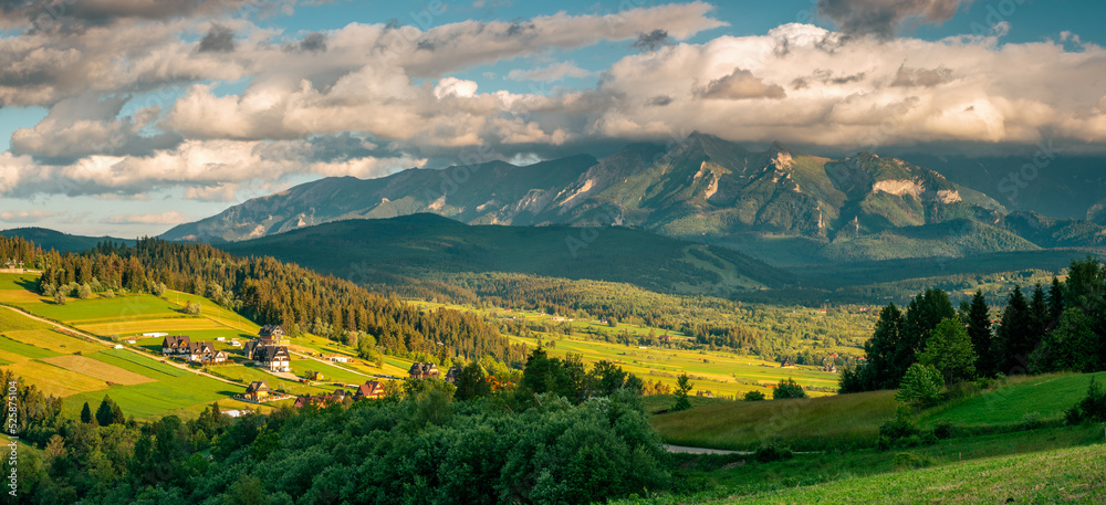 Wide panorama of Tatra Mountains in Podhale region of Poland at summer