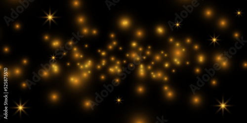 Sparkling magical dust particles.The dust sparks and golden stars shine with special light.