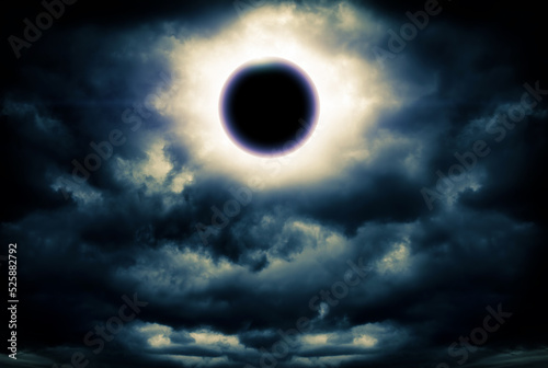 Photo Eclipse and Storm Clouds