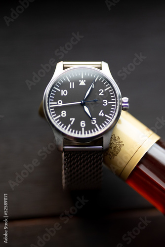 Pilot's watch on bottle