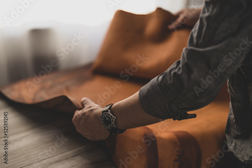 Leather working, man wearing watch