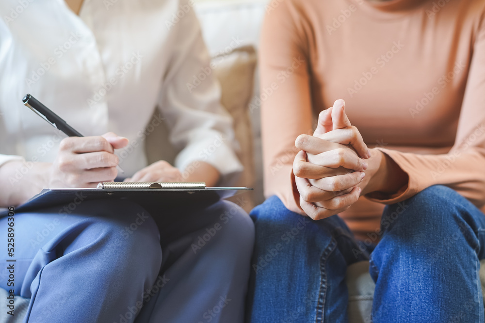 Obraz premium Psychology, depression. Sad, suffering asian young woman, consulting with psychologist, psychiatrist while patient counseling mental problem with doctor at clinic. Encouraging, therapy, health care.