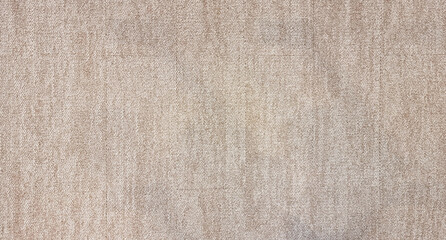 close up of monochrome beige or brown carpet texture background from above. texture tight weave carpet. the light color background of the carpet.