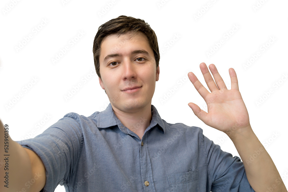 young man waving his hand in greeting on a white isolated background. portrait of a man saying hello young man waving his hand in greeting on a white isolated background. portrait of a man saying hello