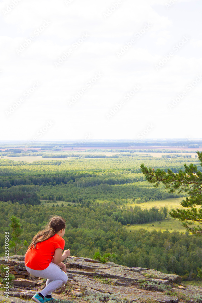 man on top of mountains in northern Kazakhstan, front and back background blurred man on top of mountains in northern Kazakhstan, front and back background blurred