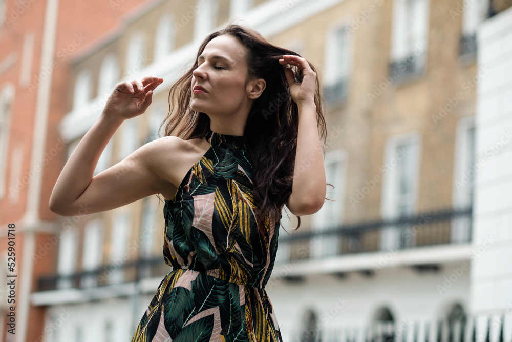 Fototapeta premium White fashion model posing in front of some London classic buildings.