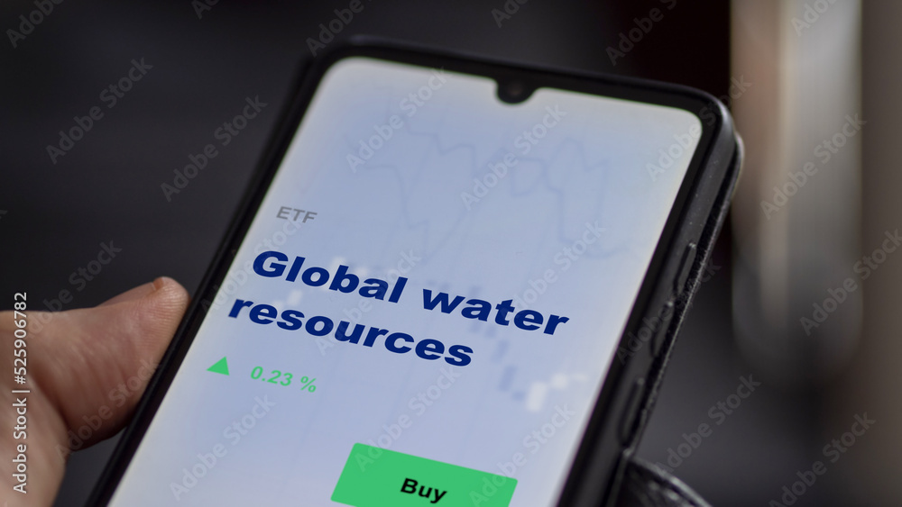 An investor's analyzing the  on screen. A phone shows the ETF's prices global water resources.